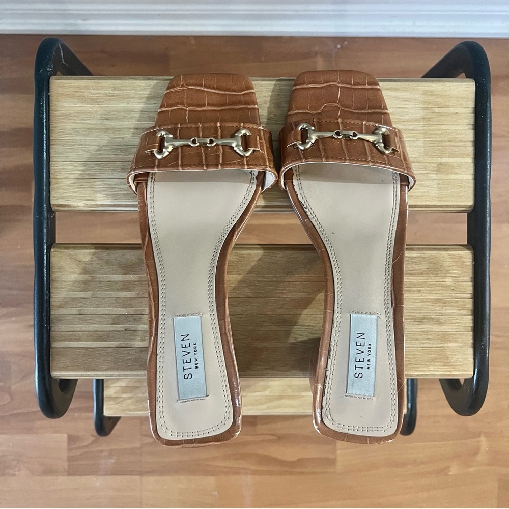 Tan croc-embossed heeled slides
